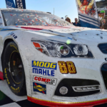 The 2014 Daytona 500 winning car of NASCAR Sprint Cup Series driver Dale Earnhardt Jr. with contingency sponsor labels such as Moog, Mahle etc.