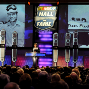 Francis Flock, widow of NASCAR Sprint Cup Series driver Tim Flock, makes a speech on behalf of her husband after he was inducted to the Hall of Fame during the NASCAR hall of fame induction ceremony at NASCAR Hall of Fame.