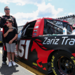 NASCAR Craftsman Truck Series driver Kyle Busch stands with his wife Samantha Busch and children Brexton and Lennix prior to the CRC Brakleen 150 at Pocono Raceway.