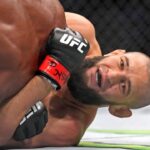 Khamzat Chimaev (red gloves) fights Kevin Holland (blue gloves) during UFC 279 at T-Mobile Arena.
