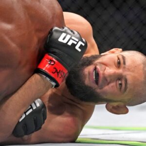 Khamzat Chimaev (red gloves) fights Kevin Holland (blue gloves) during UFC 279 at T-Mobile Arena.