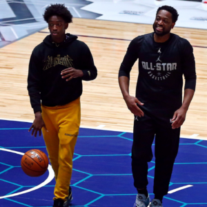 Team Lebron guard Dwayne Wade of the Miami Heat (3) with his son Zaire Blessing Dwyane Wade