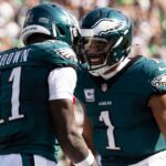 Oct 13, 2024; Philadelphia, Pennsylvania, USA; Philadelphia Eagles quarterback Jalen Hurts (1) and wide receiver A.J. Brown (11) celebrate their touchdown pass during the second quarter against the Cleveland Browns at Lincoln Financial Field.