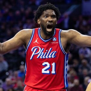 Philadelphia 76ers center Joel Embiid (21) reacts to a play against the New York Knicks during the third quarter at Wells Fargo Center