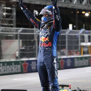 LAS VEGAS, NV - NOVEMBER 23: Max Verstappen (1) Oracle Red Bull Racing lifts his arms in the air after winning his fourth F1 world title at the Heineken Silver Las Vegas Grand Prix on Saturday, Nov. 23, 2024
