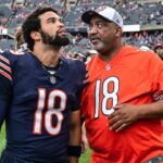Aug 17, 2024; Chicago, Illinois, USA; Chicago Bears quarterback Caleb Williams (18) talks with his father Carl Williams before the game against the Cincinnati Bengals at Soldier Field.