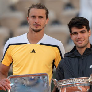 Carlos Alcaraz of Spain and Alexander Zverev of Germany pose with their trophies at the trophy presentation on day 15 of Roland Garros at Stade Roland Garros.