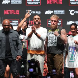 Jake Paul (right) faces off with Mike Tyson (left) during a press conference at The Pavilion at Toyota Music Factory.