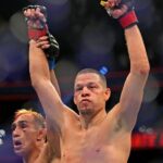 Nate Diaz (red gloves) fights Tony Ferguson (blue gloves) during UFC 279 at T-Mobile Arena.