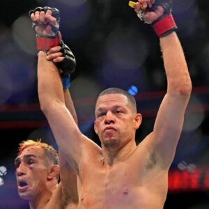 Nate Diaz (red gloves) fights Tony Ferguson (blue gloves) during UFC 279 at T-Mobile Arena.