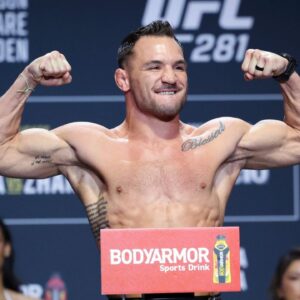 ; Michael Chandler gestures during weigh-ins for UFC 281.