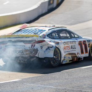 Xfinity 500 driver, DENNY HAMLIN (11) of Chesterfield, VA, brings out the caution as he wrecks during a practice session for the Xfinity 500 at Martinsville Speedway in Ridgeway, VA.