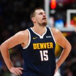 Denver Nuggets center Nikola Jokic (15) reacts in the second half against the Dallas Mavericks at Ball Arena.