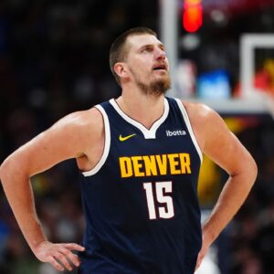 Denver Nuggets center Nikola Jokic (15) reacts in the second half against the Dallas Mavericks at Ball Arena.