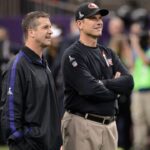 Feb 3, 2013; New Orleans, LA, USA; Baltimore Ravens head coach John Harbaugh (left) and San Francisco 49ers head coach Jim Harbaugh (right) talk before Super Bowl XLVII at the Mercedes-Benz Superdome.