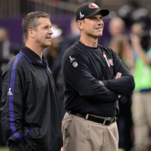 Feb 3, 2013; New Orleans, LA, USA; Baltimore Ravens head coach John Harbaugh (left) and San Francisco 49ers head coach Jim Harbaugh (right) talk before Super Bowl XLVII at the Mercedes-Benz Superdome.
