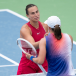 Aryna Sabalenka at the net with Iga Swiatek of Poland after their match on day seven of the Cincinnati Open.