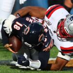 Nov 10, 2024; Chicago, Illinois, USA; New England Patriots defensive end Deatrich Wise Jr. (91) sacks Chicago Bears quarterback Caleb Williams (18) during the second half at Soldier Field.
