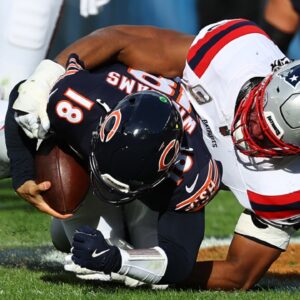 Nov 10, 2024; Chicago, Illinois, USA; New England Patriots defensive end Deatrich Wise Jr. (91) sacks Chicago Bears quarterback Caleb Williams (18) during the second half at Soldier Field.
