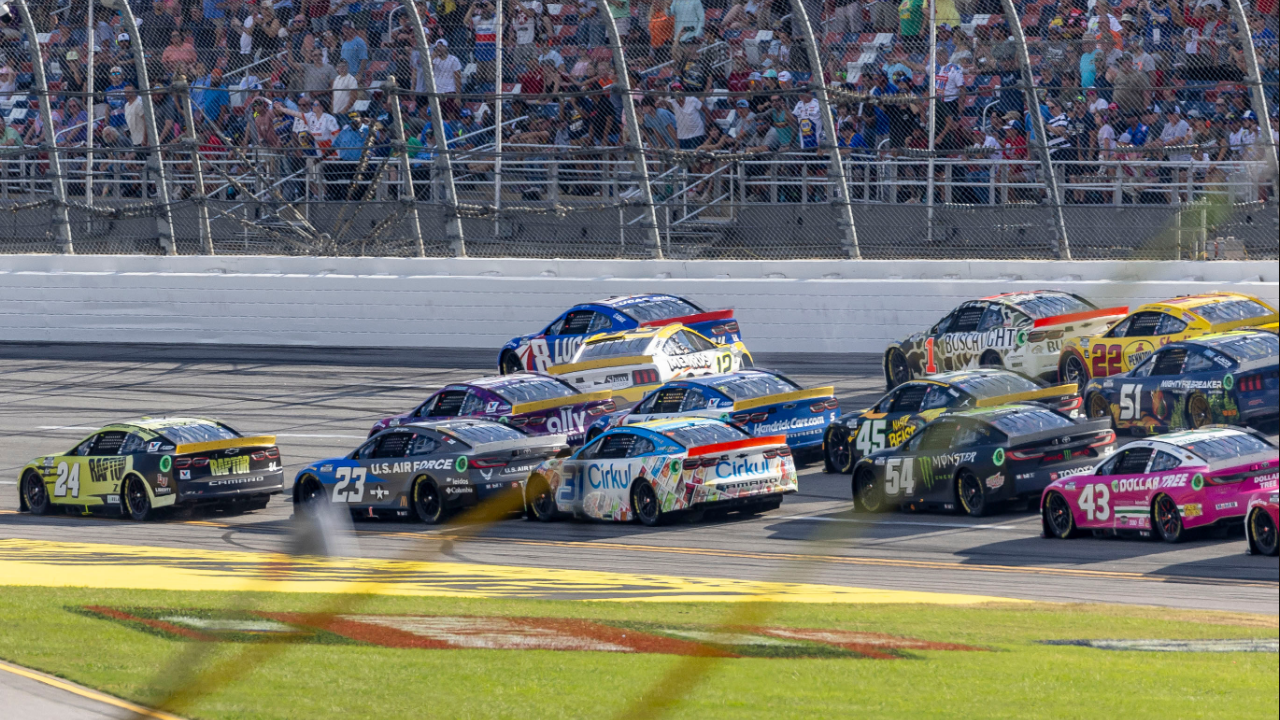 Ryan Blaney (12) crosses into Ross Chastain (1) creating a wreck in the final laps during the second stage of the YellaWood 500 at Talladega Superspeedway.