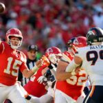 Kansas City Chiefs quarterback Patrick Mahomes (15) throws a pass against Denver Broncos defensive end Zach Allen (99) during the second half at GEHA Field at Arrowhead Stadium.