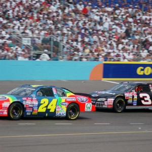NASCAR Winston Cup Series driver Jeff Gordon (24) leads Dale Earnhardt Sr (3) during the Dura Lube 500 at Phoenix International Raceway.