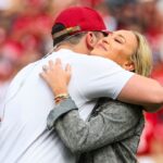 Oklahoma Sooners former player Baker Mayfield hugs his wife Emily as his statue is unveiled during the spring game at Gaylord Family Oklahoma Memorial Stadium.