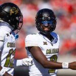Colorado Buffalos quarterback Shedeur Sanders (2) with wide receiver Travis Hunter (12) against the Arizona Wildcats at Arizona Stadium.