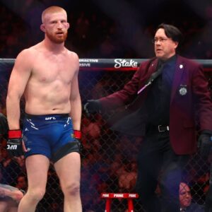 Bo Nickal (red gloves) defeats Cody Brundage (blue gloves) during UFC 300 at T-Mobile Arena.