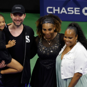 Serena Williams (USA) (M-R) poses for a picture with daughter Olympia (L), husband Alexis Ohanian (M-L), and sister Isha Price (R)
