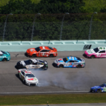 NASCAR Cup Series driver Corey LaJoie (7) spins in front of NASCAR Cup Series driver Kyle Busch (8) and NASCAR Cup Series driver Daniel Suarez (99) during the Straight Talk Wireless 400 at Homestead-Miami Speedway.