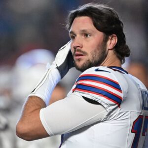Buffalo Bills quarterback Josh Allen (17) stands on the sidelines before the game against the Indianapolis Colts at Lucas Oil Stadium.