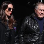 Former New England Patriots head coach Bill Belichick and girlfriend Jordon Hudson enter the field before the game between the Notre Dame Fighting Irish and the Navy Midshipmen at MetLife Stadium.