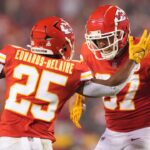 Oct 10, 2022; Kansas City, Missouri, USA; Kansas City Chiefs tight end Travis Kelce (87) celebrates a touchdown with running back Clyde Edwards-Helaire (25) at GEHA Field at Arrowhead Stadium.