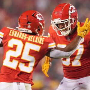 Oct 10, 2022; Kansas City, Missouri, USA; Kansas City Chiefs tight end Travis Kelce (87) celebrates a touchdown with running back Clyde Edwards-Helaire (25) at GEHA Field at Arrowhead Stadium.
