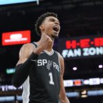 San Antonio Spurs center Victor Wembanyama (1) celebrates in the second half against the Golden State Warriors at Frost Bank Center.