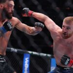 New York, NY, USA; Bo Nickal (red gloves) fights Paul Craig in the middleweight bout during UFC 309 at Madison Square Garden.