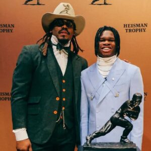 Cam Newton with Travis Hunter at the Heisman Trophy Ceremony.