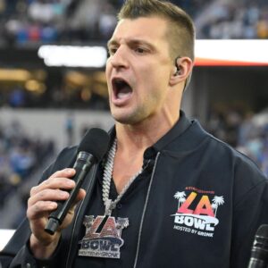 Rob Gronkowski (middle) sings the during the National Anthem with the New Directions Veterans Choir before the Starco Brands LA Bowl at SoFi Stadium. Gronkowski is the host of the game.