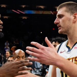 Denver Nuggets center Nikola Jokic (right) greets Phoenix Suns forward Kevin Durant following the game at Footprint Center.
