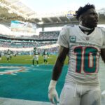 Miami Dolphins wide receiver Tyreek Hill (10) celebrates after defeating the New York Jets during overtime at Hard Rock Stadium.