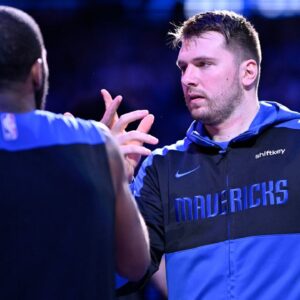Dallas Mavericks guard Kyrie Irving (11) greets guard Luka Doncic (77) before the game against the Minnesota Timberwolves at the American Airlines Center.