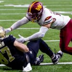 Dec 15, 2024; New Orleans, Louisiana, USA; New Orleans Saints tight end Foster Moreau (87) catches a touchdown pass to get within 1 point of he Washington Commanders during the second half at Caesars Superdome.