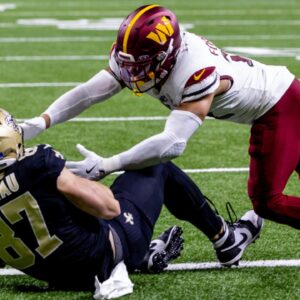 Dec 15, 2024; New Orleans, Louisiana, USA; New Orleans Saints tight end Foster Moreau (87) catches a touchdown pass to get within 1 point of he Washington Commanders during the second half at Caesars Superdome.
