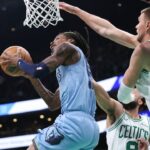 Memphis Grizzlies guard Ja Morant (12) shoots during the second half against the Boston Celtics at TD Garden.