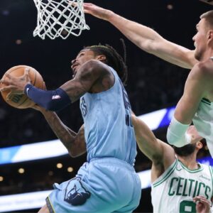 Memphis Grizzlies guard Ja Morant (12) shoots during the second half against the Boston Celtics at TD Garden.