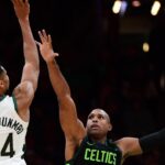 Milwaukee Bucks forward Giannis Antetokounmpo (34) shoot the ball over Boston Celtics center Al Horford (42) during the second half at TD Garden.