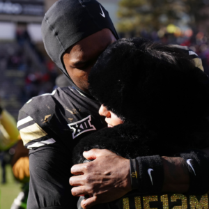Colorado Buffaloes wide receiver Travis Hunter (12) hugs his girl friend following the win against the Oklahoma State Cowboys at Folsom Field.