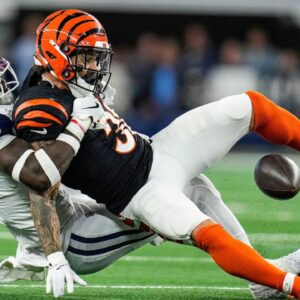Dallas Cowboys linebacker DeMarvion Overshown takes down Cincinnati Bengals running back Chase Brown (30) Monday Night Football at AT&T Stadium in Arlington,Texas on Monday, December 9, 2024.