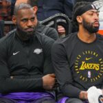 Los Angeles Lakers forward LeBron James (23) and forward Anthony Davis (3) on the bench against the Minnesota Timberwolves in the fourth quarter at Target Center